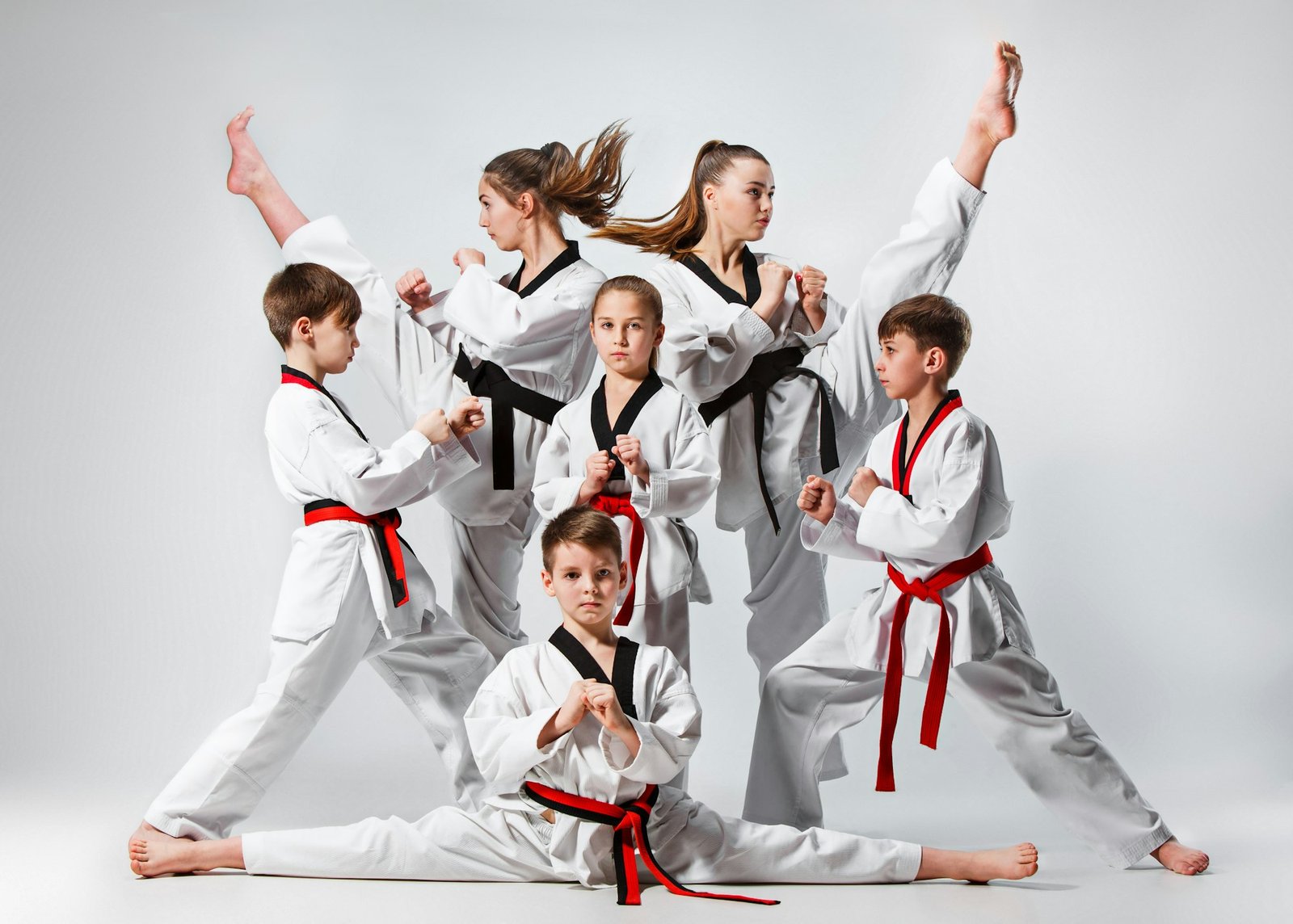 The studio shot of group of kids training karate martial arts